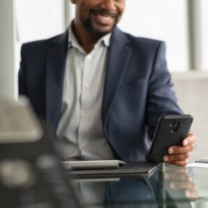 Man smiling while working at a computer