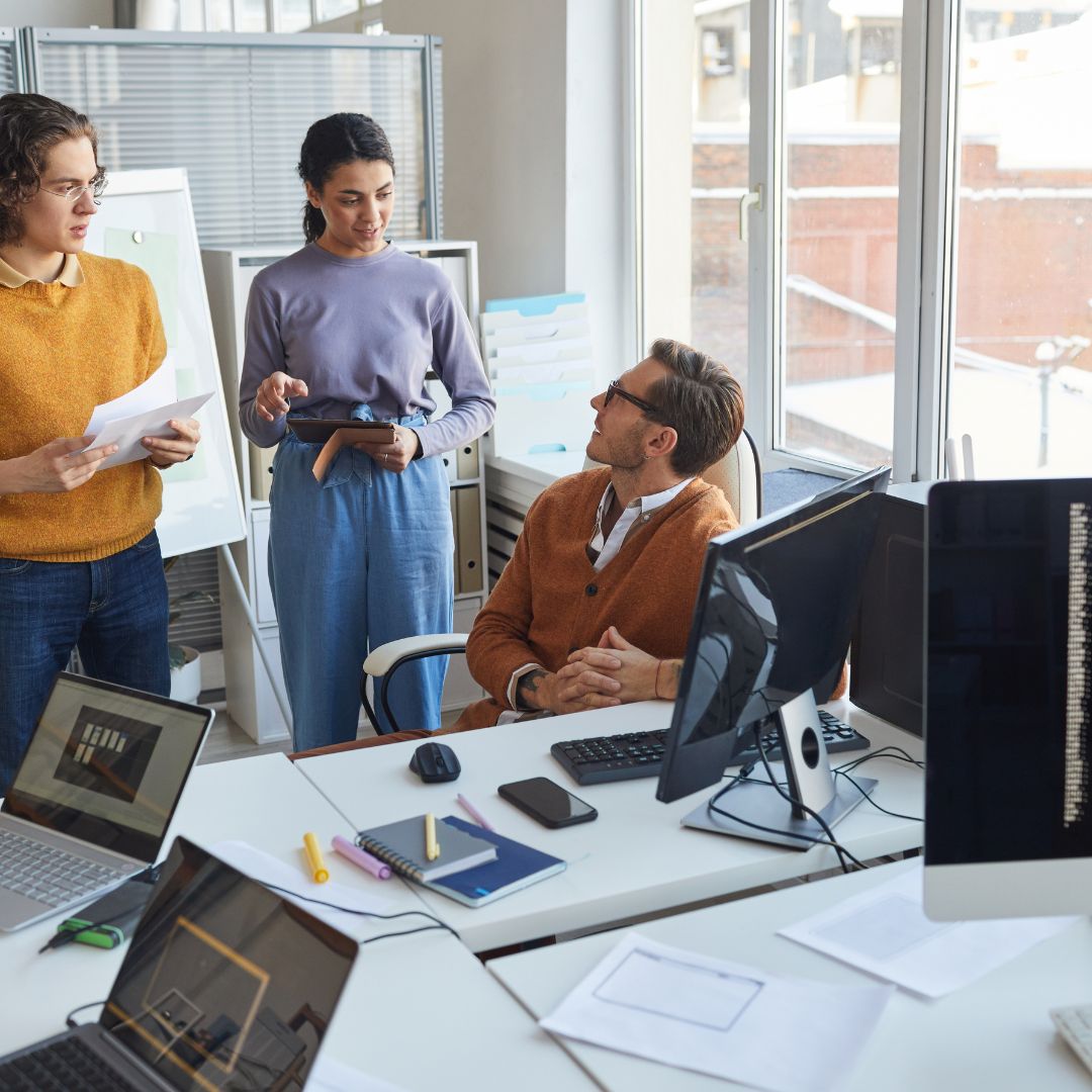 IT workers conversing together